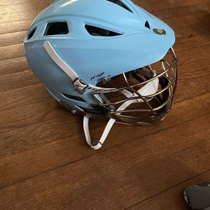 Lacrosse haul. Helmet, pads, and gloves.